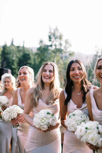 bridesmaids stand for luxury wedding ceremony at montage deer valley utah