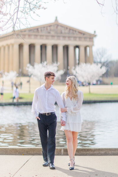 Engaged couple in front of the Nashville Parthenon by Nashville wedding photographer Brooke Elliott