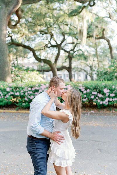 A couple kissing in Downtown Savannah Georgia for engagement session
