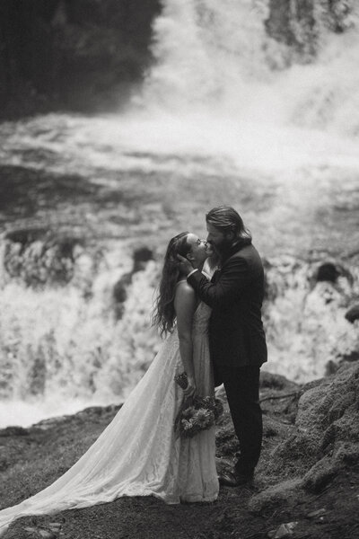 detail wedding photo of bride holding vows wearing wedding dress