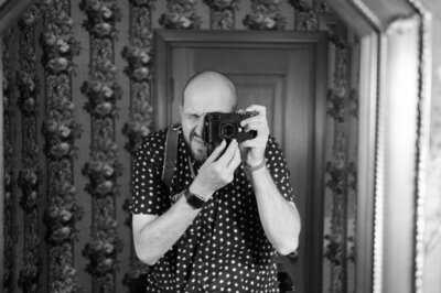 Photographer takes a black and white mirror selfie