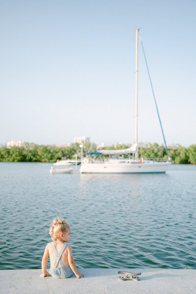 Toddler boy looking at the boats by Miami Family Photographer