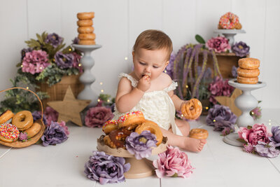 one year old girl in kelowna for her floral themed donut smash