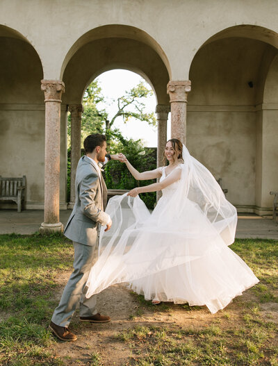 Groom holding bride from behind