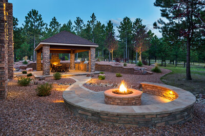 Florida luxury outdoor living space with firepit by Southern Outdoor Spaces