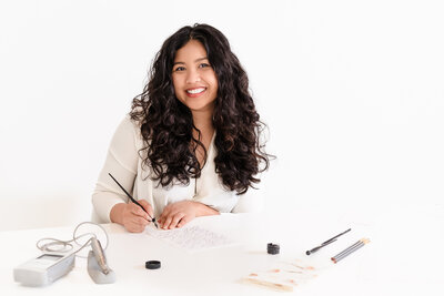brand photo of a Calligrapher doing her craft