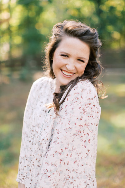brunette woman smiling in outdoor portraits