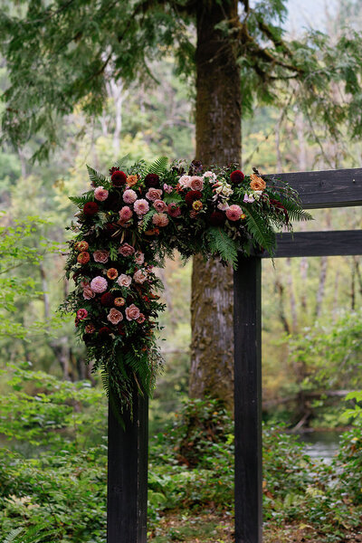 Flower installation on arbor in woods