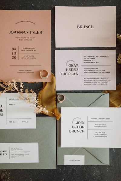 Pink and white wedding invitations with sage green envelopes