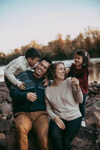 Family Photographer, family of four laughing and smiling together