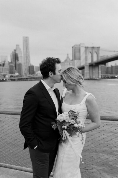photo of couple on bridge in new york city