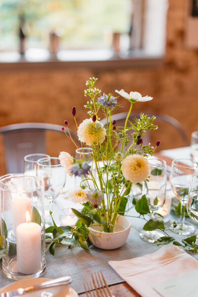 Flowers on table from wedding that took place at Mass MoCa