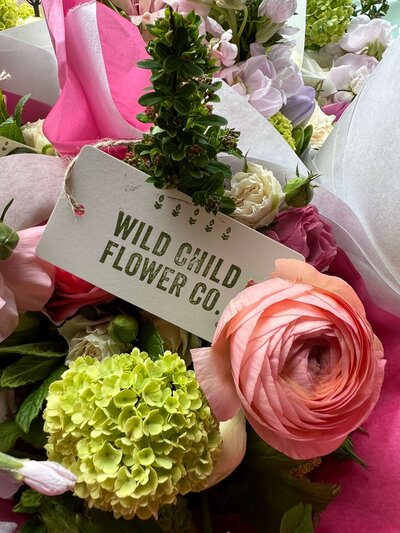 Flowers with tag and Wild Child Flower Co logo
