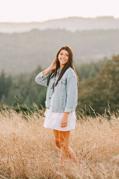 A high school senior poses for senior portraits at Fitton Green in Corvallis