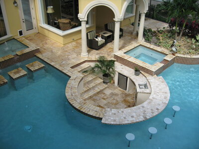 Luxury North Florida custom backyard with pool and outdoor kitchen by Southern Outdoor Spaces