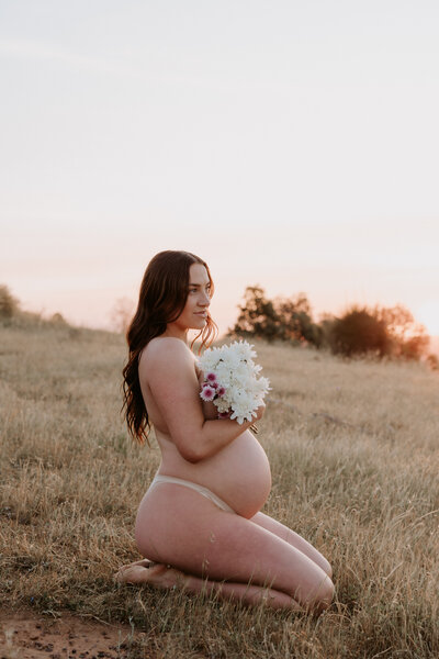 outdoor maternity photography session with flowers 