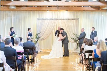 ceremony first kiss for wedding at huguenot loft in Greenville