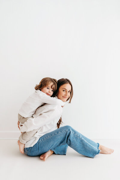 Photograph of a smiling baby on their Christmas Mini Photoshoot