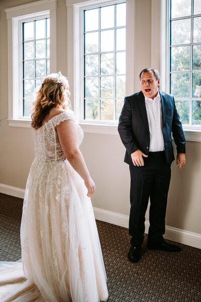 a father and daughter bride having a first look on her wedding day in New Hampshire