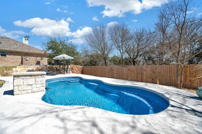 Private pool at this three-bedroom, two-bathroom vacation rental lake house that sleeps eight just steps away from Stillhouse Hollow Lake in Belton, TX.