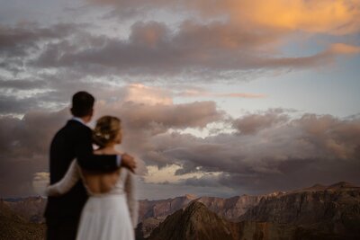 Bride and groom on a mountain top during their adventure elopement