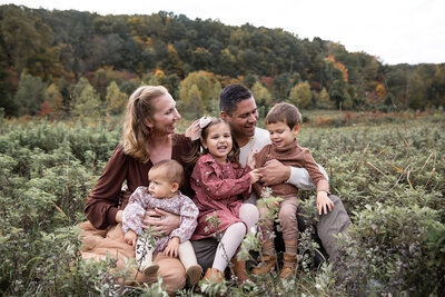 Ingrid-Berrios-cuddles-with-her-family-during-a-photoshoot-in-Baltimore-Maryland
