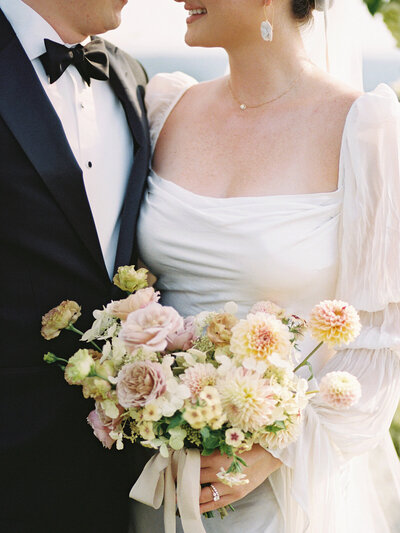 White, blush bouquet, roses, dahlias, ranunculus, black silk ribbon
