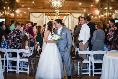 Couple Kisses after ceremony at The Venue at Southern Oaks in Mississippi