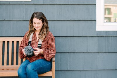 a woman putting a camera into a camera bag