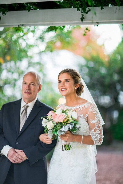 bride and her father walking down the isle in asheville nc