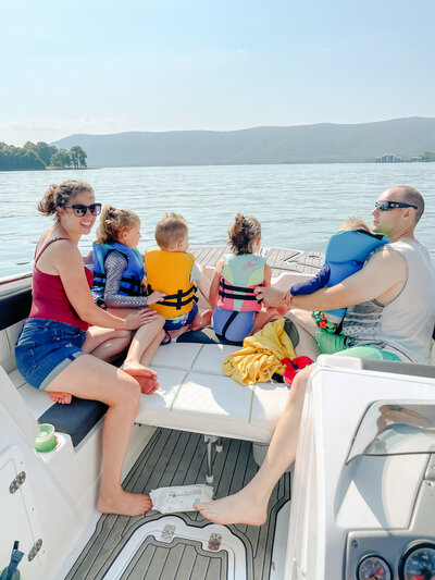 A portrait of the Thomas Family on a speedboat