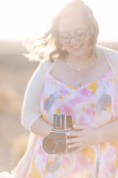 Portrait of Shayla Cristine holding a Hasselblad camera