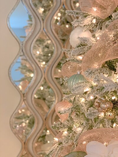 Christmas tree with mirror behind