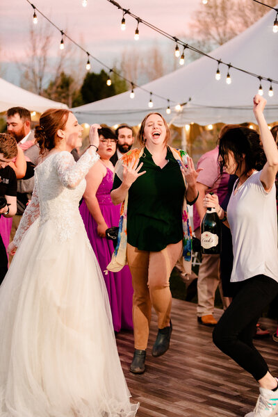 Grand Teton wedding photographer captures bride dancing with Jackson Hole photographer