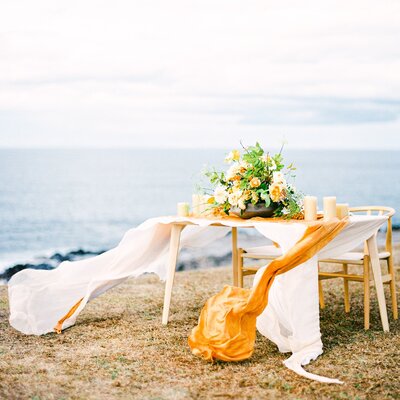 a table for tropical elopement on Maui beautiful tropical orange flowers