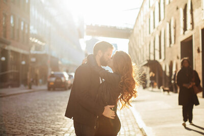 Couple dressed up as they embrace during NYC Engagement Session