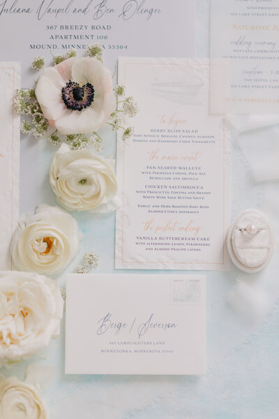 floral flatlay featuring wedding invitation suite