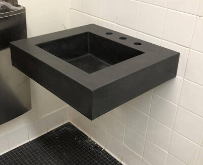 Floating concrete sink that meets ADA sink requirements in cast concrete single basin