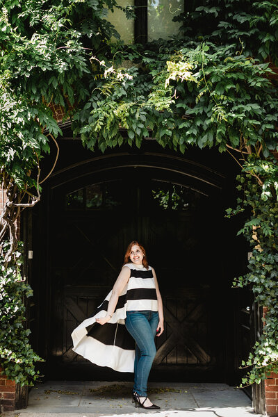 woman with stripped shirt with ivy door
