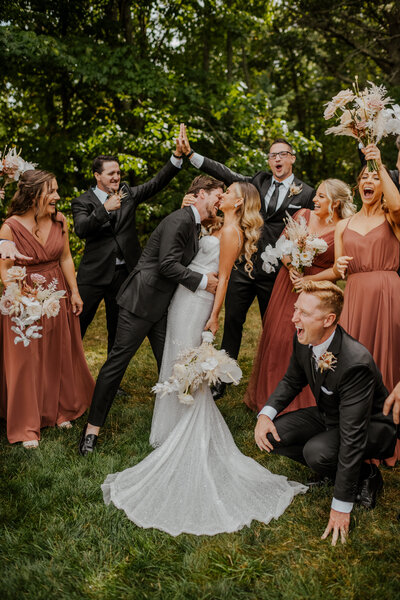 candid photo of wedding party laughing