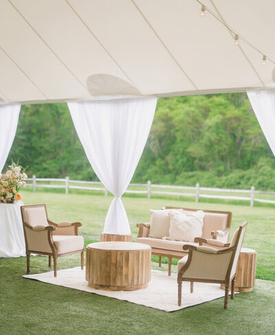 summer tented wedding with lounge seating.