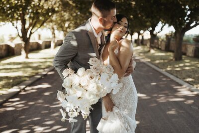 Couple Posing in a Tree Lined Driveway - Leeann & Carlin | Abeja Winery & Inn Intimate Wedding Walla Walla Washington