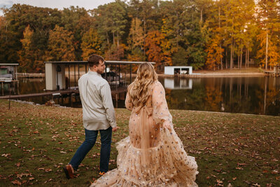 couple walking in field in autumn season