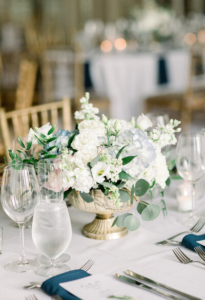 wedding reception table with white flowers