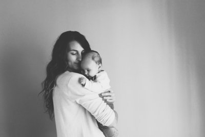 Canva - Happy Mother Holding Adorable  Baby Girl