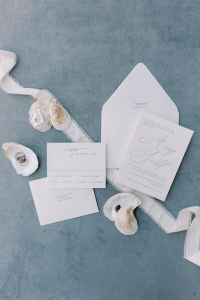 Blue and white styled invite suit with oyster shells