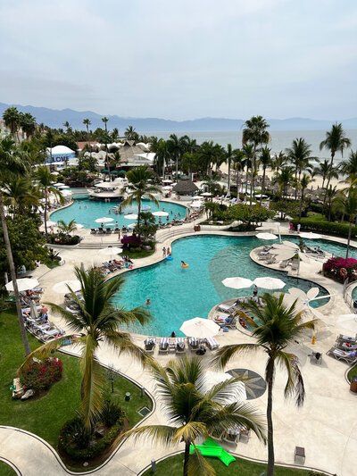 The tranquil resort pool, an ideal backdrop for destination weddings, showcasing elegance and relaxation.