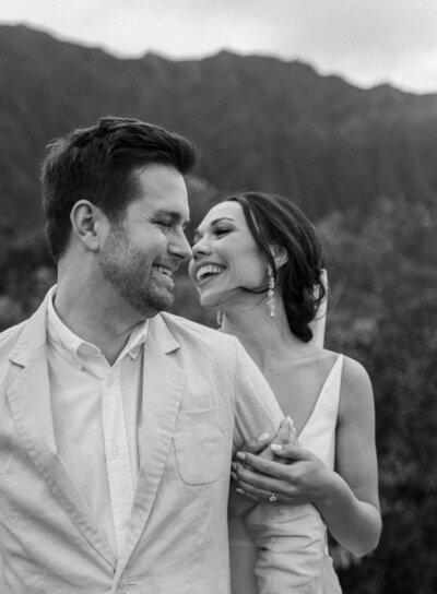 Couple laughing together on wedding day