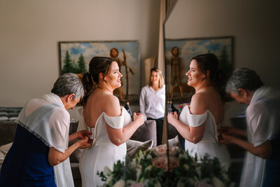 bride and bridesmaids in hotel room photos at The Lodge at St Edward State Park Hotel