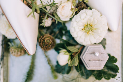 Flatlay of rings and flowers